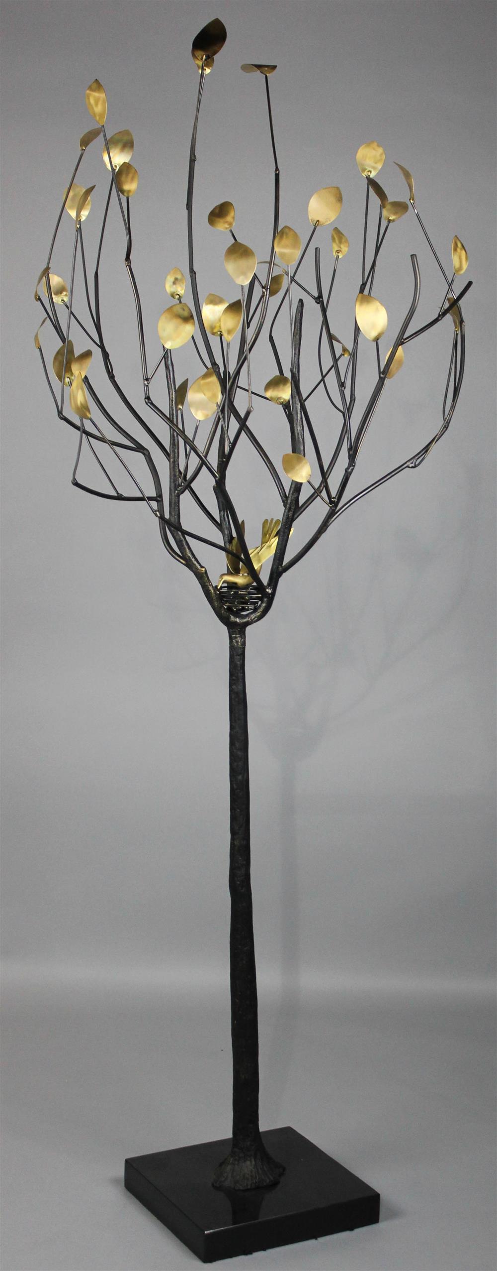 Appraisal: DECORATIVE SCULPTURAL METAL TREE with gold-tone leaves and bird's nest