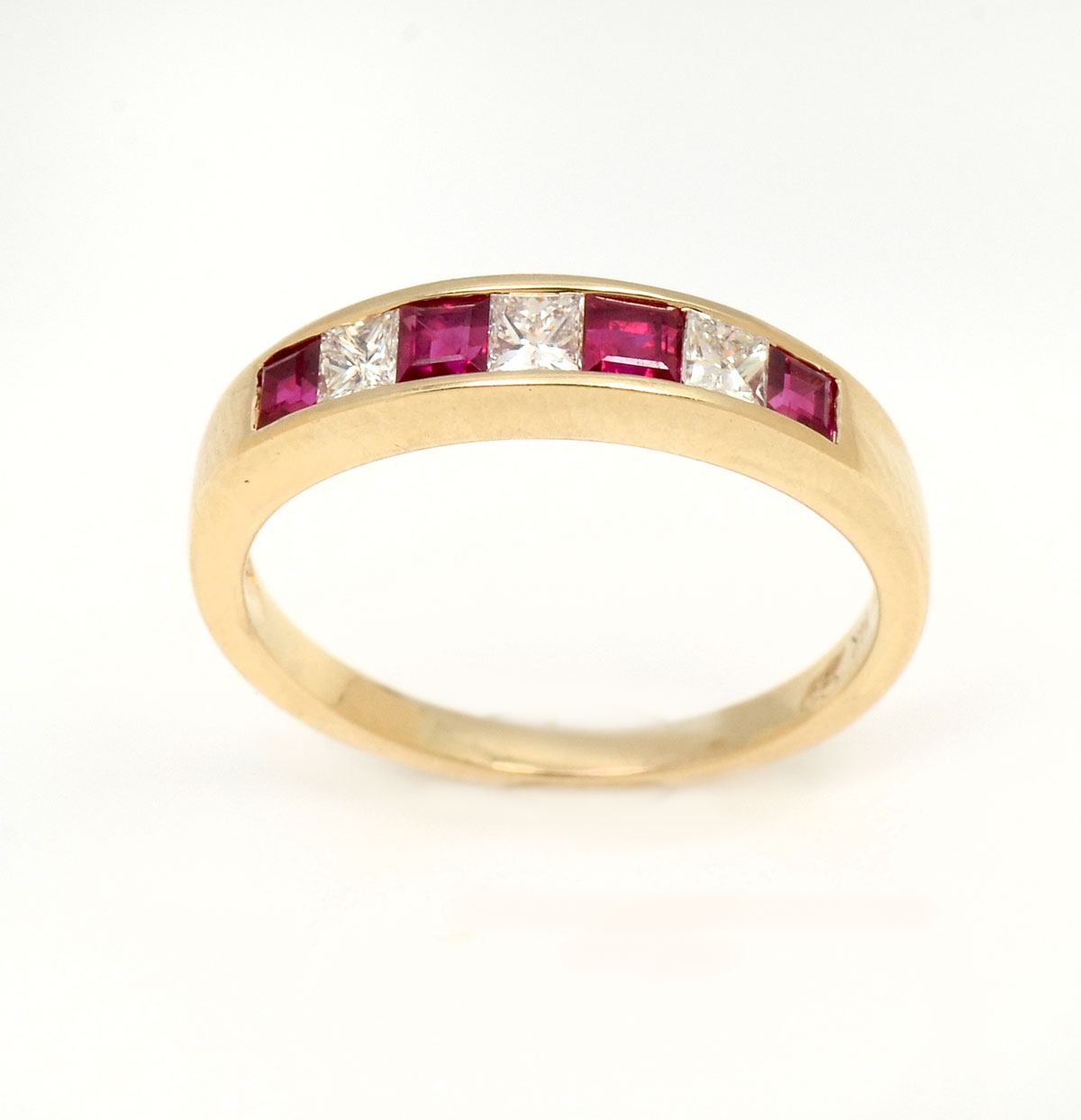 Appraisal: K RUBY DIAMOND BAND princess cut rubies and princess cut