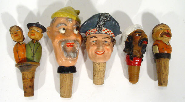 Appraisal: Five hand painted carved wooden and papier mache figural bottle