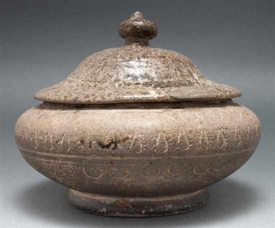 Appraisal: Korean earthenware covered jar th th century with stylized incised