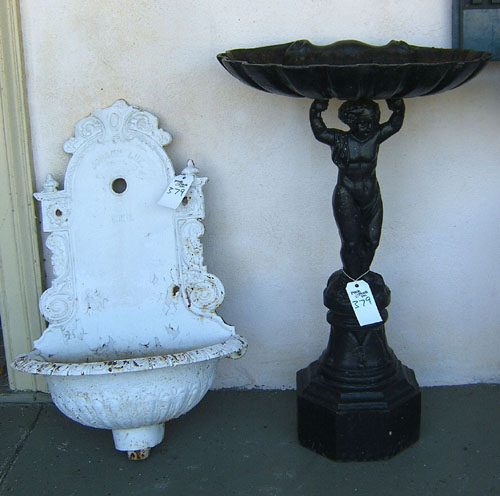 Appraisal: Two cast iron bird baths late th early th c