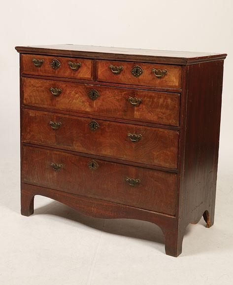 Appraisal: A GEORGE II MAHOGANY CHEST OF DRAWERS the rectangular crossbanded