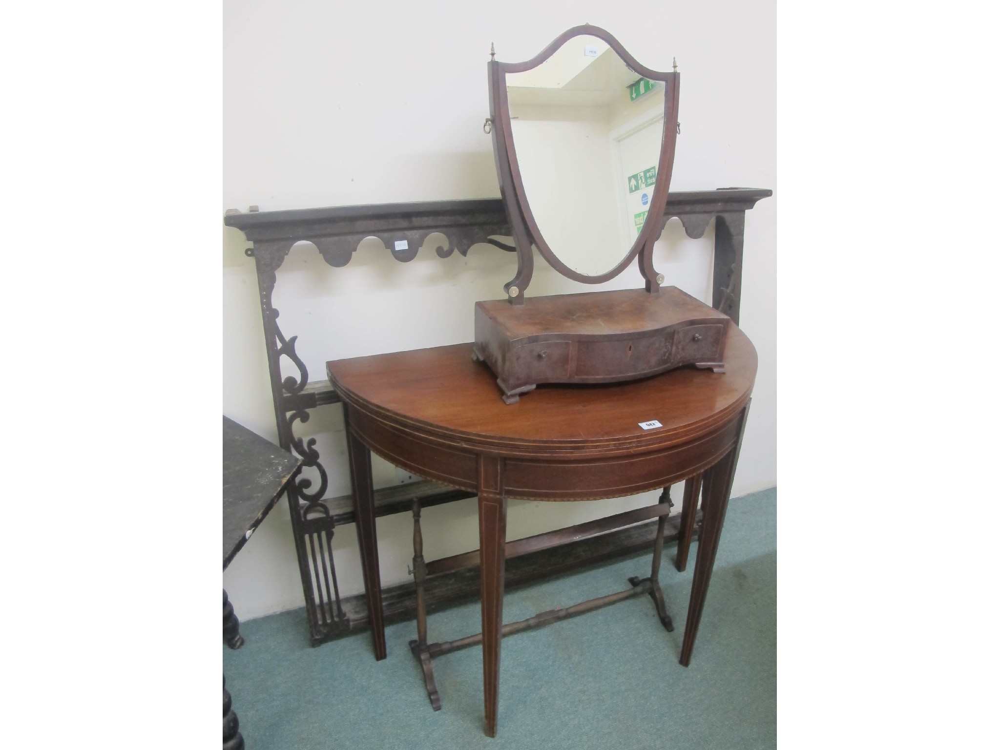 Appraisal: A mahogany D-end table plate rack and two dressing mirrors