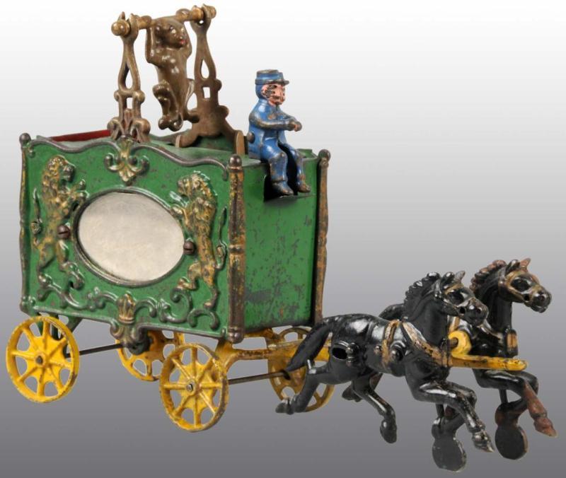 Appraisal: Cast Iron -Horse Royal Circus Trapeze Wagon Description Includes monkey