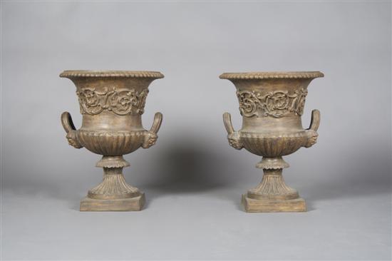 Appraisal: A Pair of Victorian Style Cast Iron Urns Height inches