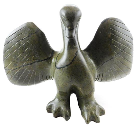 Appraisal: Carved green stone sculpture depicting swan with outstretched wings indistinctly