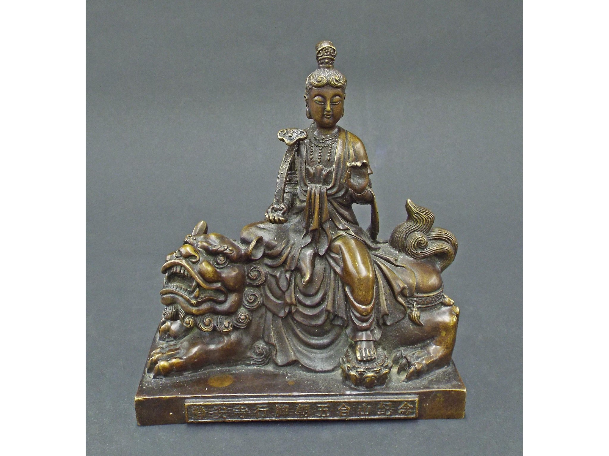 Appraisal: Chinese bronze figure of a deity on the back of