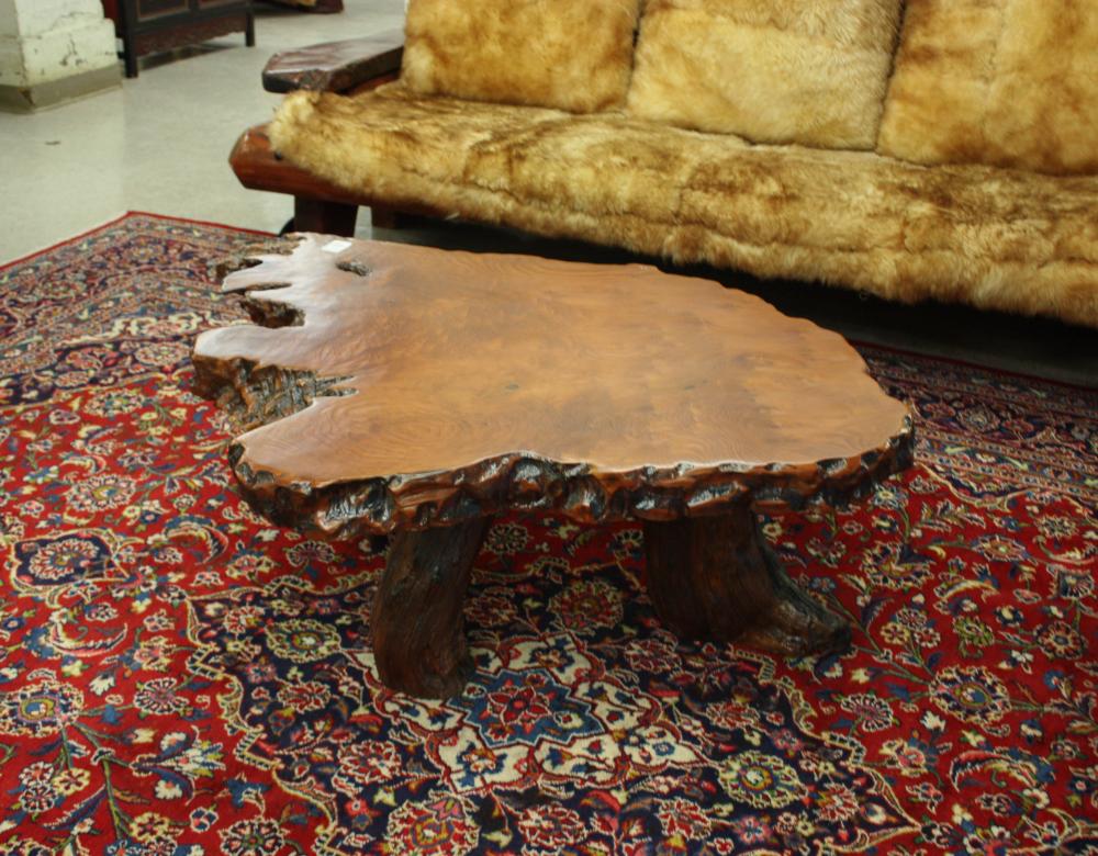 Appraisal: ARTISAN STUDIO REDWOOD COFFEE TABLE having a freeform redwood slab