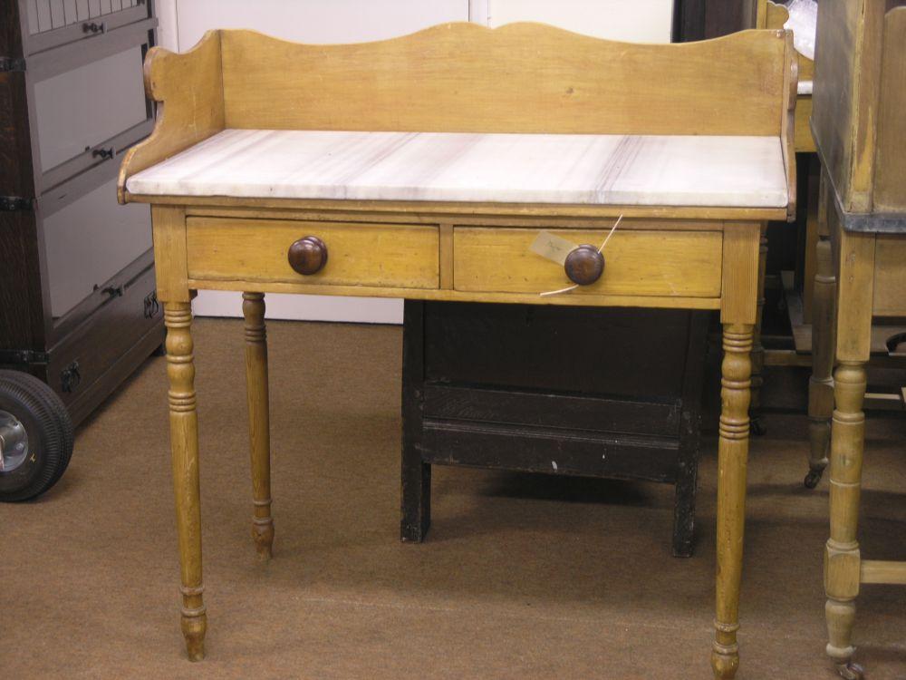 Appraisal: A Victorian waxed pine washstand with marble top two frieze