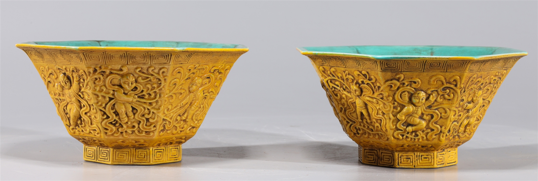 Appraisal: Pair of Chinese yellow and turquoise glazed octagonal faceted bowls