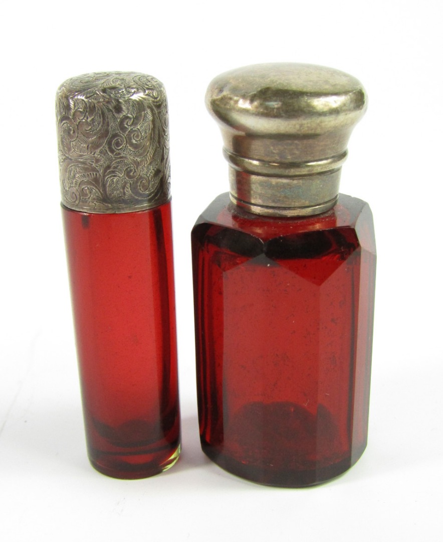 Appraisal: A Victorian cranberry glass scent bottle of cylindrical form with