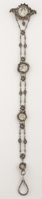 Appraisal: Silver portrait with red stones and seed pearls - long