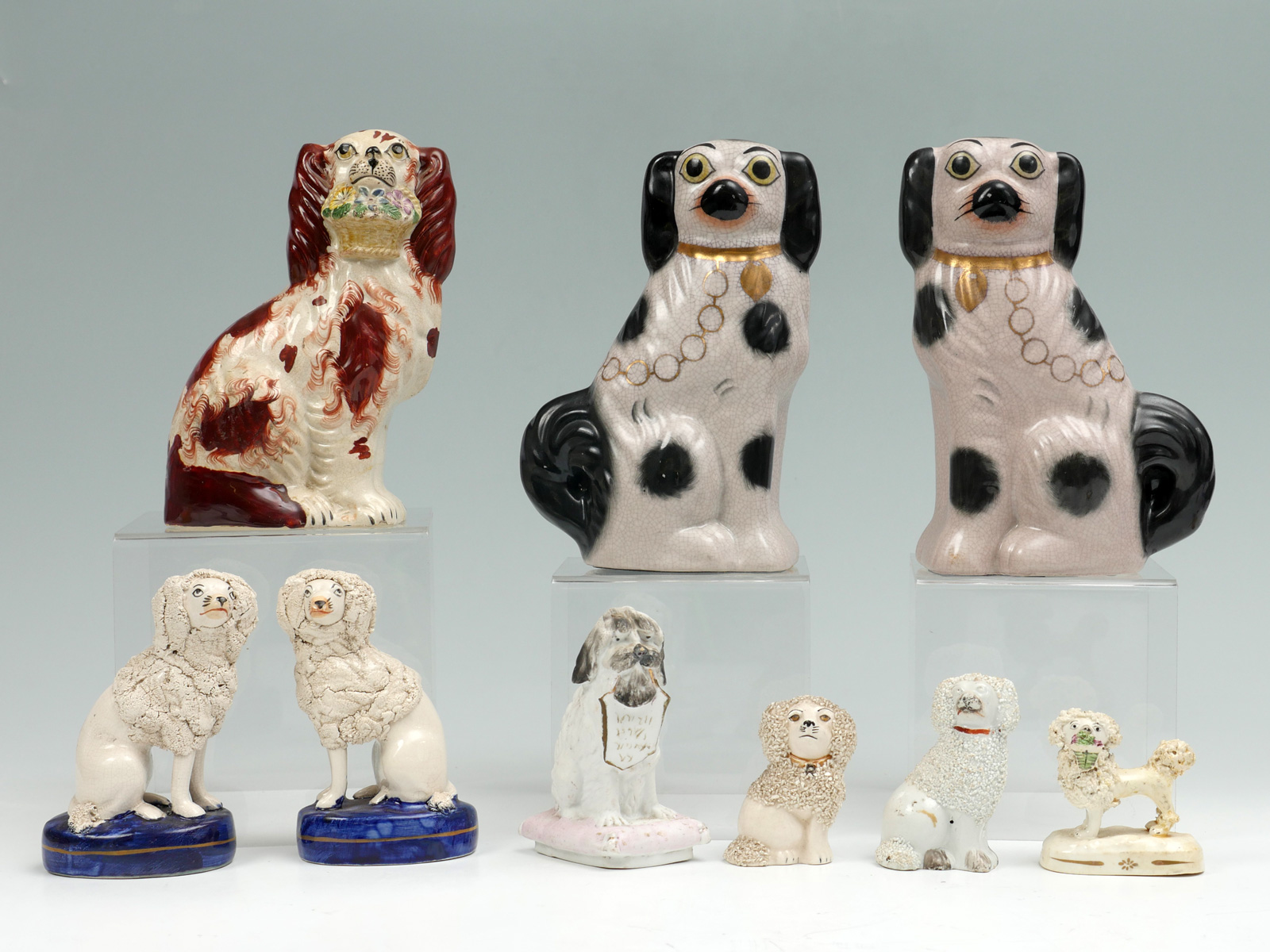 Appraisal: PC STAFFORDSHIRE PORCELAIN DOG STATUES Comprising - Opposing Cocker Spaniels