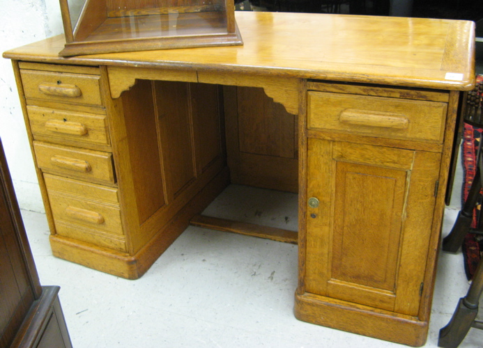 Appraisal: AN OAK FLAT-TOP DESK American late th century The double