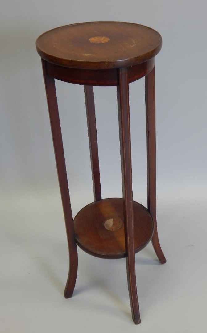 Appraisal: An Edwardian mahogany and marquetry two tier plant stand cm