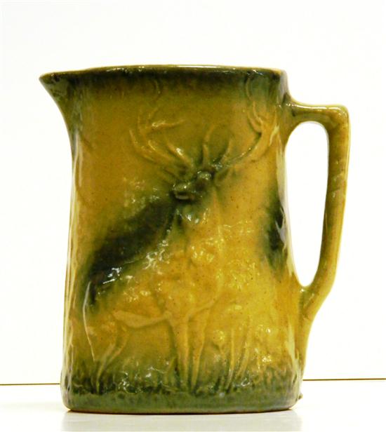 Appraisal: Stoneware pitcher with stag in relief applied handle three small