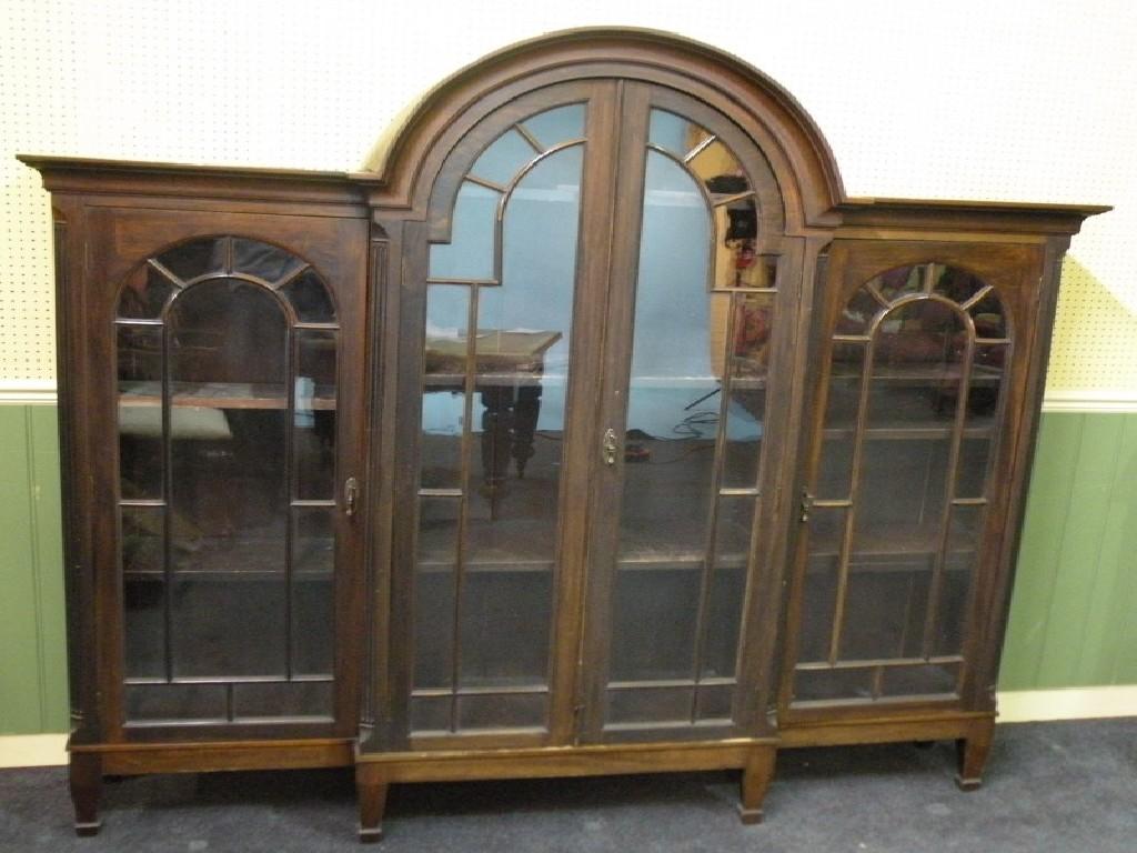 Appraisal: A late th-early thC walnut display cabinet with an arched