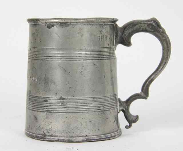 Appraisal: An early th Century pewter mug with double scroll handle