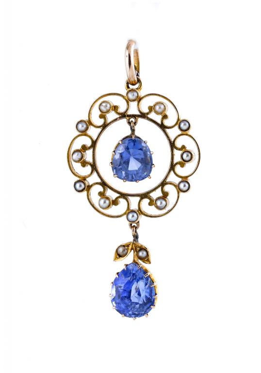 Appraisal: A BLUE STONE AND SEED PEARL OPENWORK PENDANT in gold