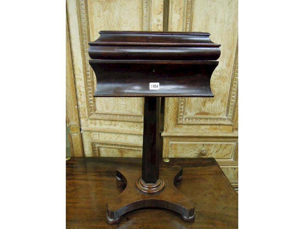 Appraisal: A Victorian rosewood teapoy of sarcophagus form with fitted interior