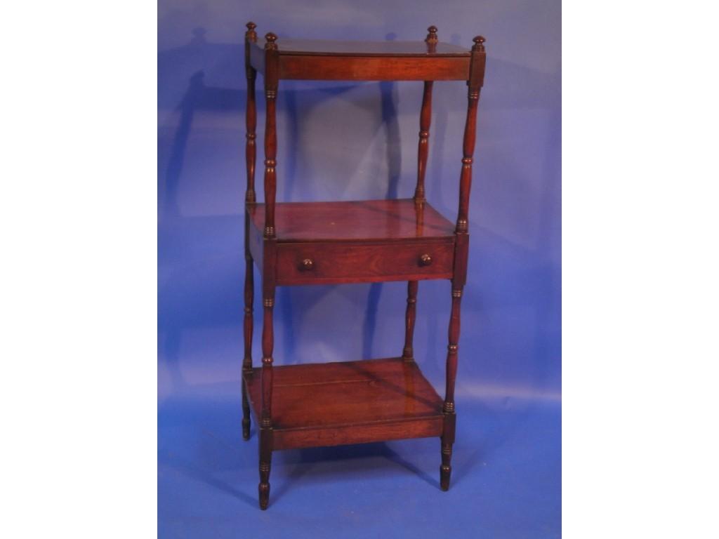 Appraisal: A Georgian mahogany three tier whatnot fitted with a shallow