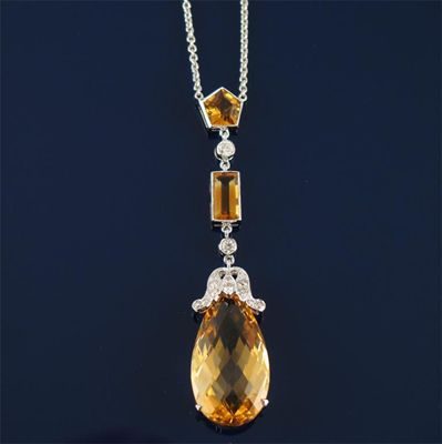 Appraisal: A citrine and diamond pendant Set in white gold on