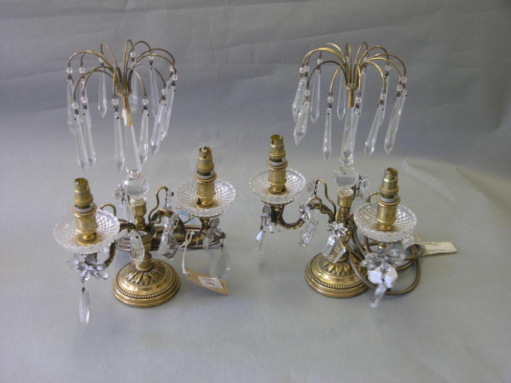 Appraisal: A pair of brass and cut glass electric table lustres