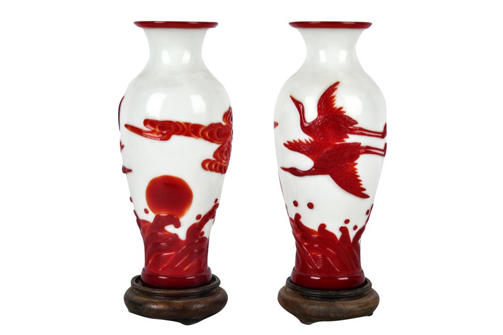 Appraisal: PAIR OF PEKING GLASS VASESeach on a wood stand Provenance