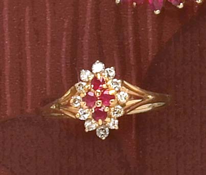 Appraisal: DIAMOND AND RUBY RING k yellow gold ring set with