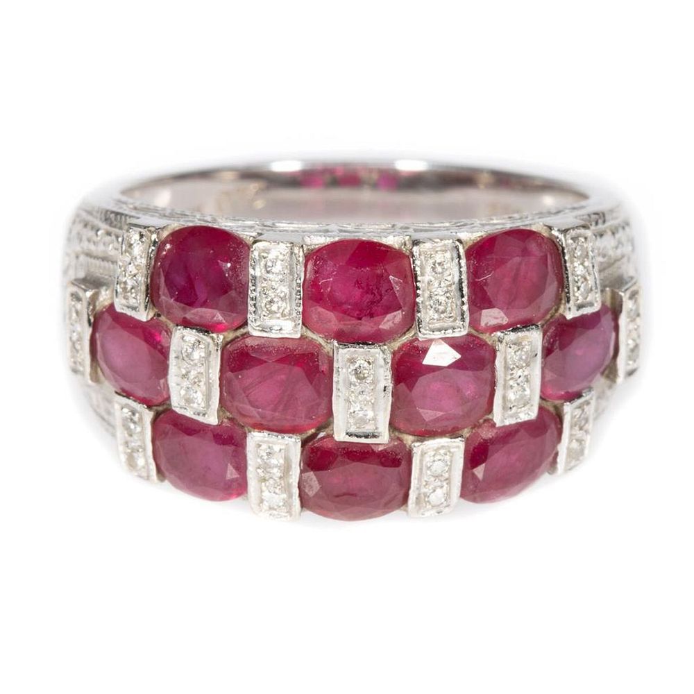 Appraisal: Ruby diamond and k gold ring featuring oval-shaped rubies each