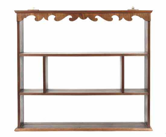 Appraisal: A Georgian Style Mahogany Hanging Etagere having a stepped cornice