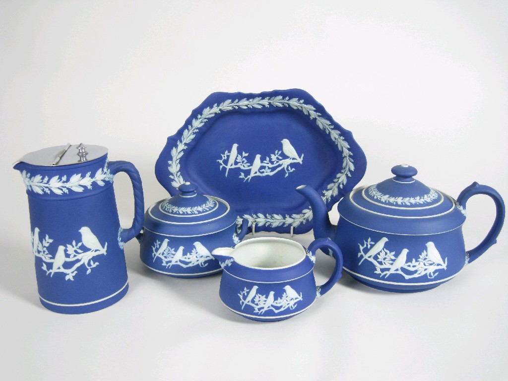 Appraisal: A Wedgwood jasperware four piece Tea Service and oval Saucer