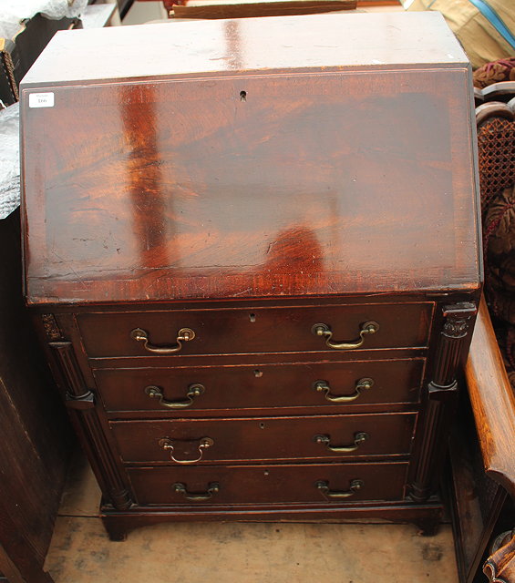 Appraisal: AN EDWARDIAN MAHOGANY BUREAU the fall front enclosing a fitted