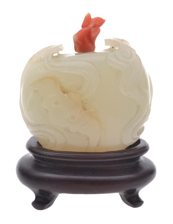 Appraisal: A CARVED JADEITE SNUFF BOTTLE WITH CORAL STOPPER