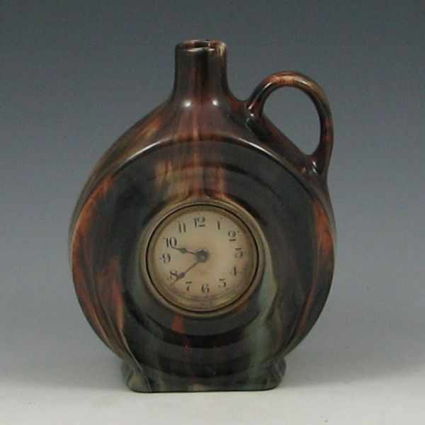 Appraisal: Brush-McCoy Onyx Jug Time Clock X jug is unmarked clock