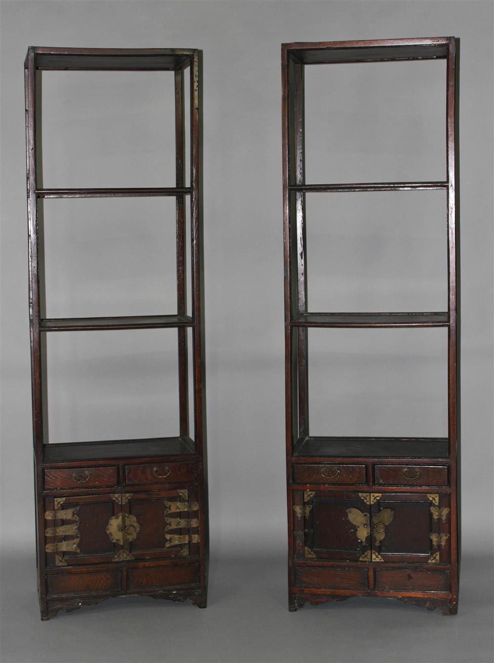 Appraisal: PAIR OF NARROW KOREAN BOOKSHELVES the narrow frames fitted with