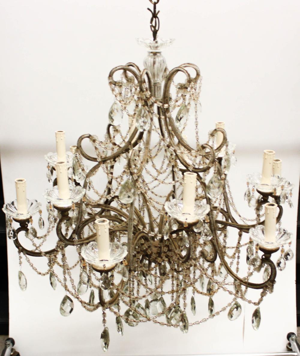 Appraisal: FRENCH STYLE TWELVE-LIGHT CHANDELIER the metal frame strung with chains