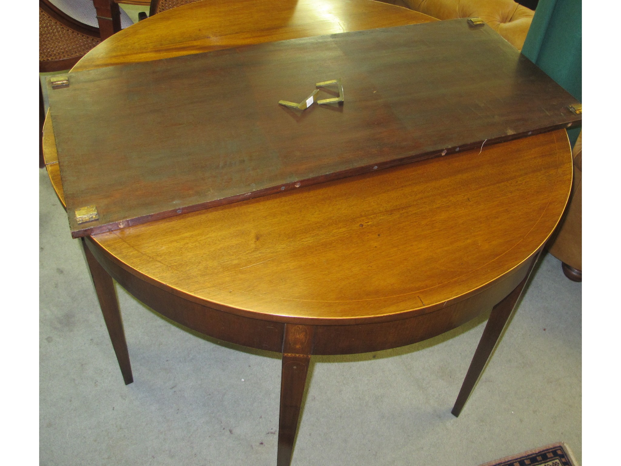 Appraisal: A th Century mahogany D-end dining table with spare leaf