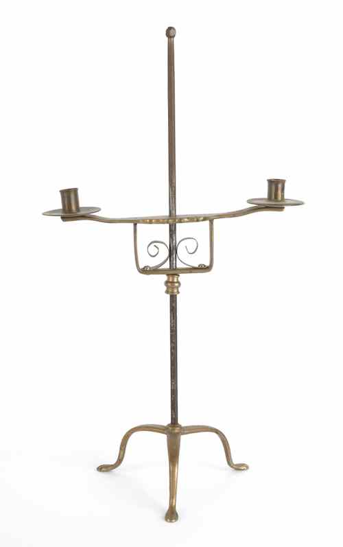 Appraisal: Wrought iron and brass adjustable table top candlestand with two