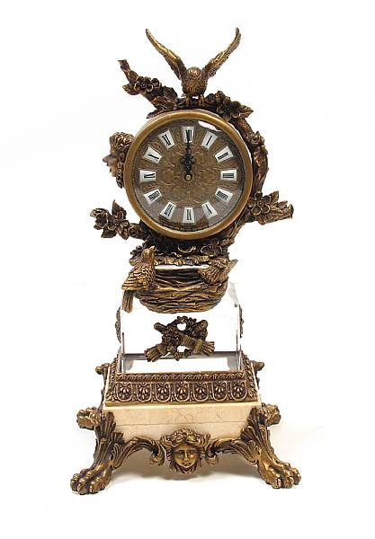 Appraisal: A patinated bronze and crystal clock height in length in