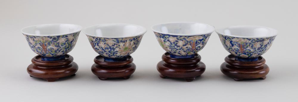 Appraisal: FOUR CHINESE POLYCHROME ENAMELED PORCELAIN WINE CUPS TH CENTURY HEIGHTS