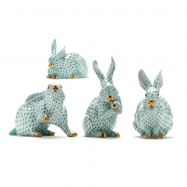 Appraisal: FOUR HEREND PORCELAIN RABBITS Green fishnet with crossed paws rabbit