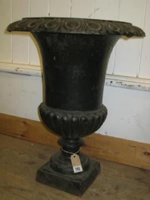 Appraisal: A PAIR OF VICTORIAN CAST IRON GARDEN URNS of semi