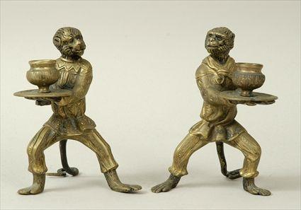 Appraisal: Two Brass Monkey-Form Candle Holders x in