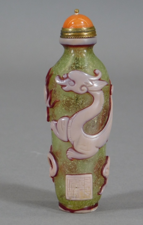 Appraisal: CHINESE PEKING GLASS CHILONG SNUFF BOTTLE China th CenturyCylindrical bottle