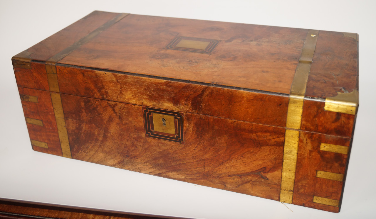 Appraisal: A Victorian walnut and brass bound writing box with a