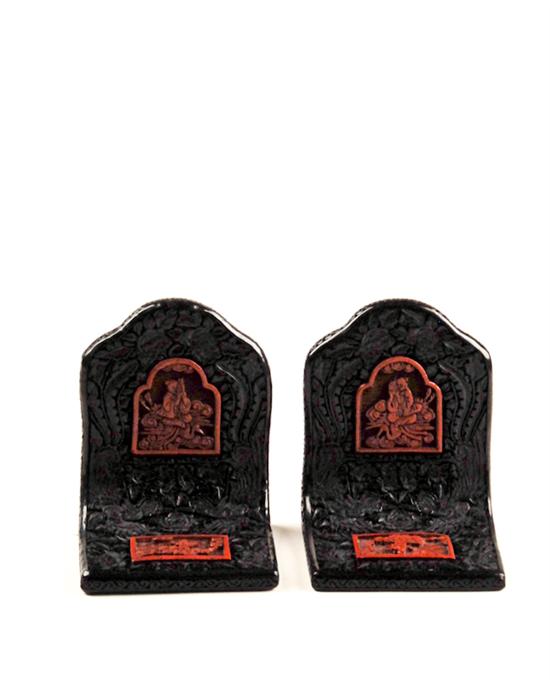 Appraisal: A Pair of Carved Cinnabar Bookends heavily weighted and having