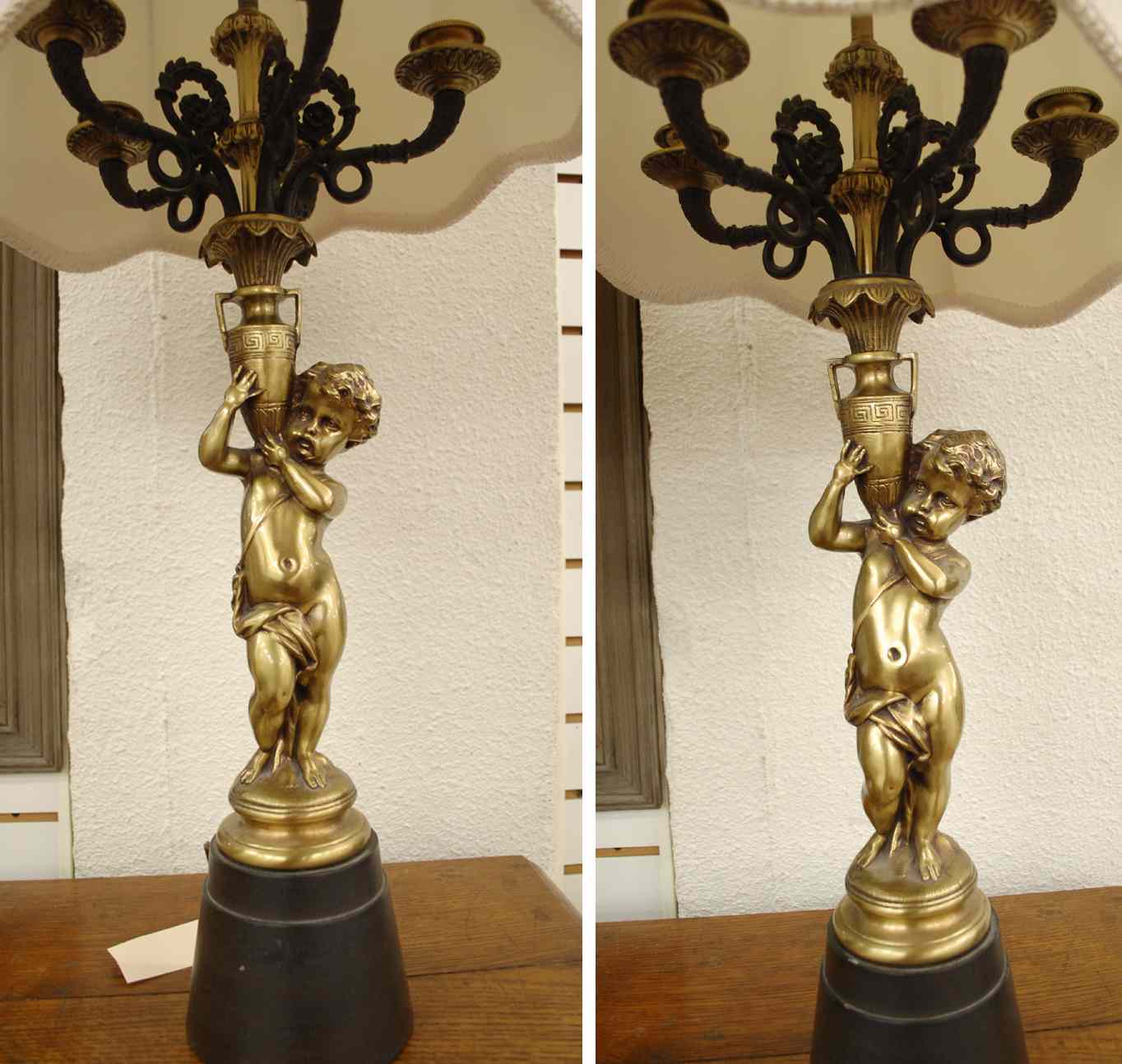 Appraisal: PAIR FIGURAL BRASS TABLE LAMPS Cupids support the standards on