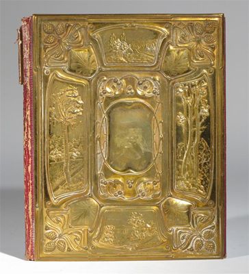 Appraisal: A cast brass book cover on leather and card boards