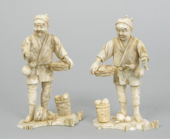 Appraisal: A Pair of Carved Ivory Figurines A pair of carved